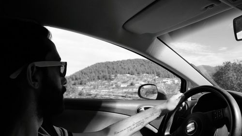 Close-up of man driving car