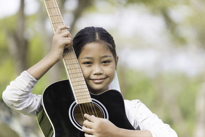 Portrait of man playing guitar
