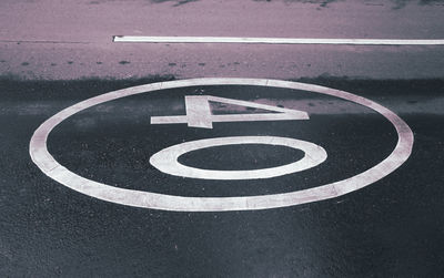 High angle view of road sign on street