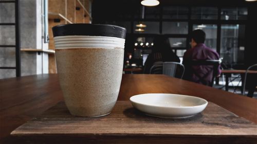 Close-up of coffee cup on table in restaurant