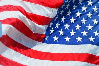 Close-up of flag against blue sky