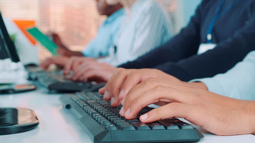 Midsection of man using laptop