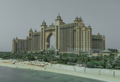 View of buildings in city against clear sky