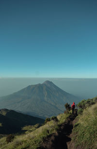 Scenic view of mountains against clear blue sky. mount merbabu, indonesia