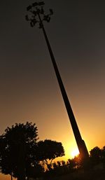 Silhouette trees against sky during sunset