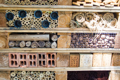 Full frame shot of various wooden objects on shelf