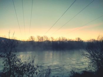 Scenic view of landscape against sky during winter