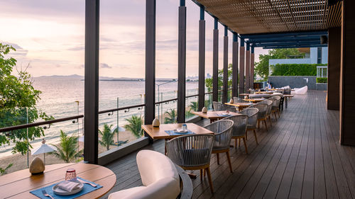 Empty chairs and tables in restaurant