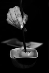 Close-up of hand holding ice cream