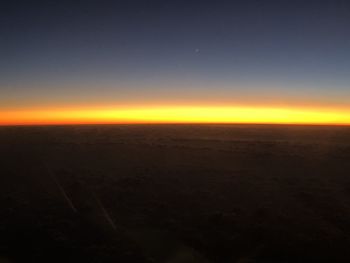 Scenic view of sea against clear sky during sunset