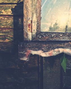 Close-up of rusty metal against sky