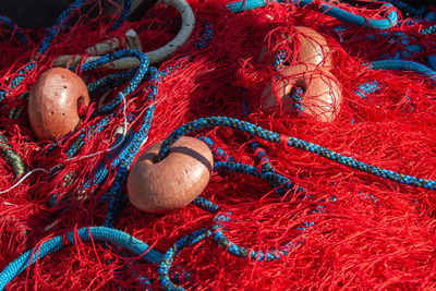 The object of red - blue fishing nets and floats .