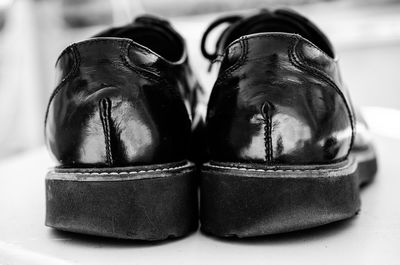 Close-up of shoes on table