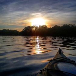 Scenic view of lake at sunset