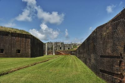 View of building with lawn in foreground