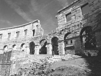 Low angle view of old ruin building against sky