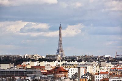 View of eiffel tower against cloudy sky