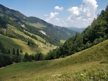 Scenic view of landscape and mountains against sky