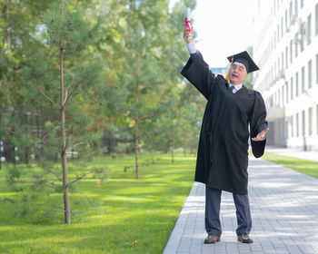 Rear view of man standing in park