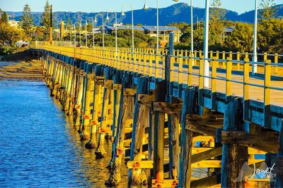 Panoramic shot of bridge over river against sky