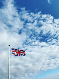 Low angle view of flag against sky