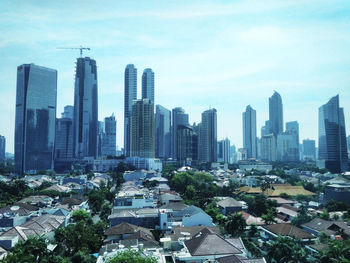 High angle view of buildings in city against sky