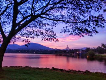 Scenic view of lake against sky at sunset