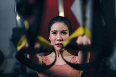 Portrait of woman exercising at gym