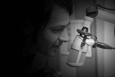 Close-up of radio jockey talking on microphone