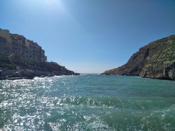 Scenic view of sea against clear blue sky