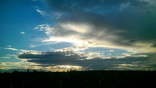 Silhouette of landscape against sunset sky