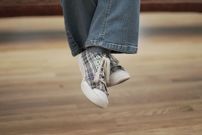 Low section of woman walking outdoors