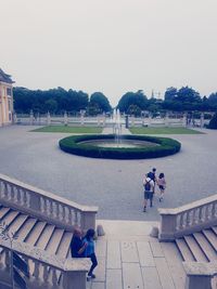People on footpath against sky