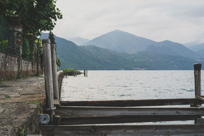 Scenic view of lake orta against sky and mountains