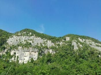 Scenic view of mountains against clear blue sky