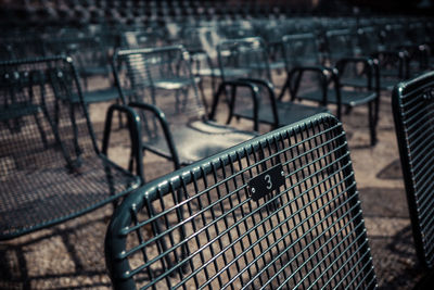 Close-up of metallic chair with number