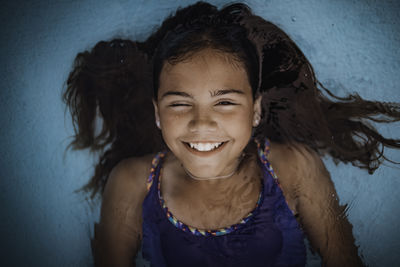 Portrait of smiling girl swimming in pool