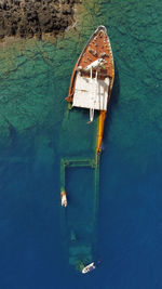 High angle view of shipwreck boat floating on sea