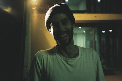 Portrait of smiling man standing outdoors