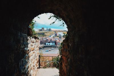 Buildings seen through arch window