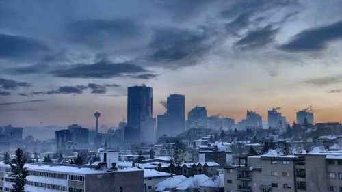 Cityscape against sky during sunset