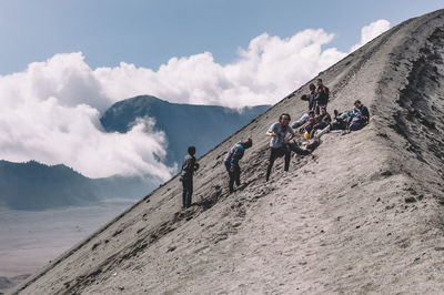 Cheerful hikers at mt bromo against sky