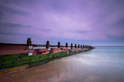 Scenic view of sea against sky at sunset