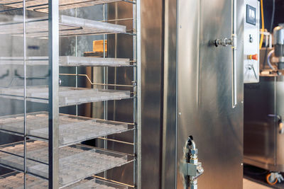 Shelving with molds for pouring chocolates. manufacturin for automatic production of chocolate. 