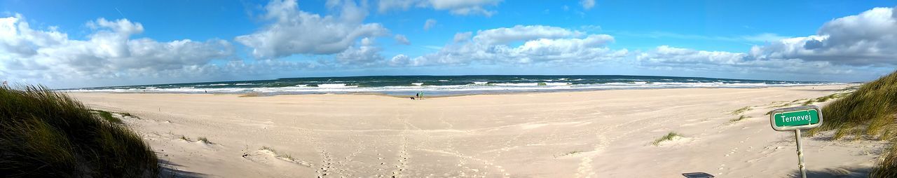 Panoramic view of sea against cloudy sky