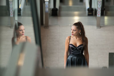 Woman wearing sleeveless dress indoors