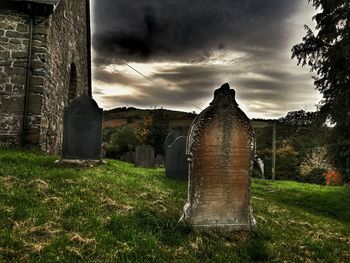 Old ruin on field against sky