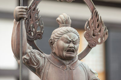 Close-up of statue against temple