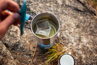Close-up of hand holding drink