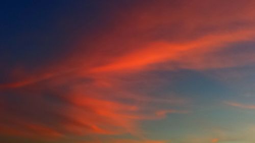 Low angle view of dramatic sky during sunset